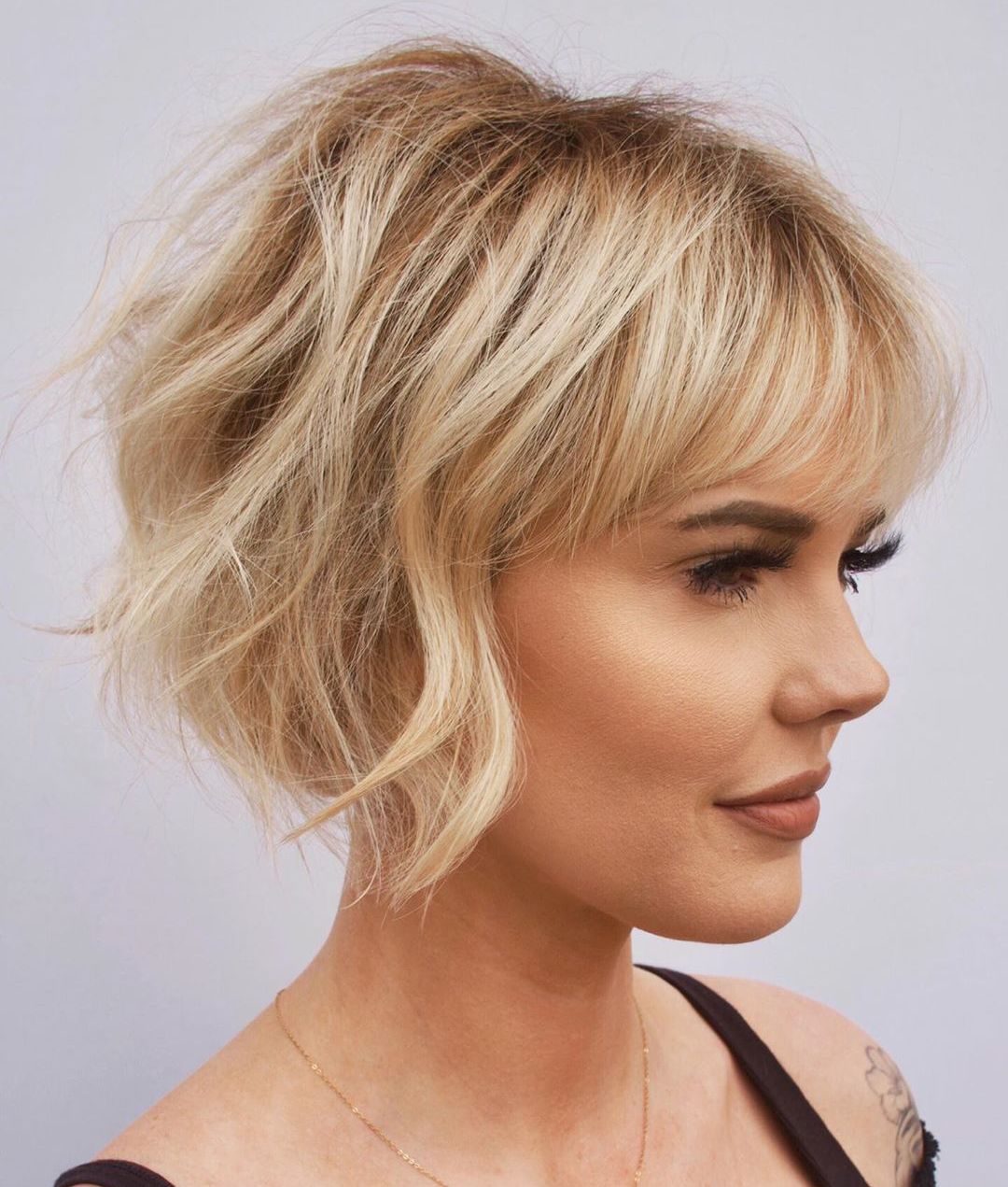Short Womenโs Haircut with Bangs