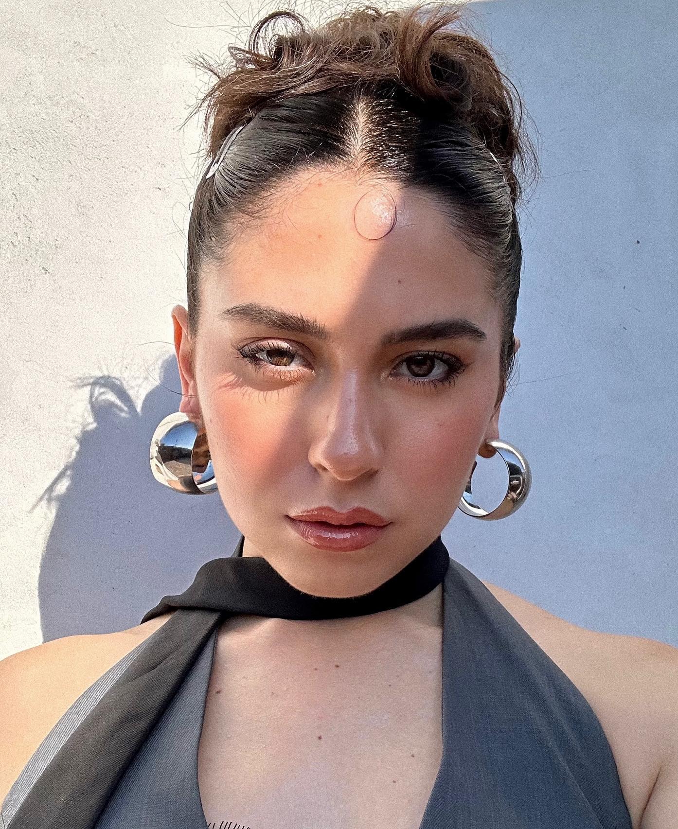 10. Sleek Top Knot with a Modern Twist for Short Hair