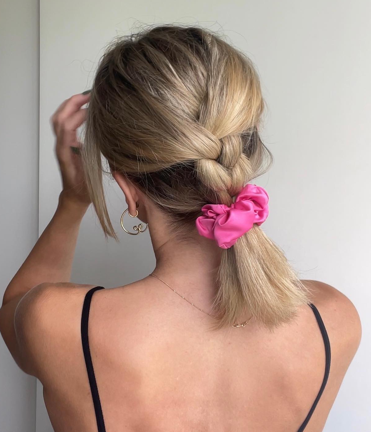 16. Effortless Elegance: A Classic Braid with a Playful Pop