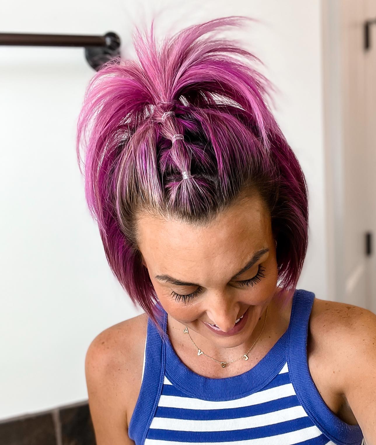 25. Playful Pink Mohawk with Braided Crisscross Design