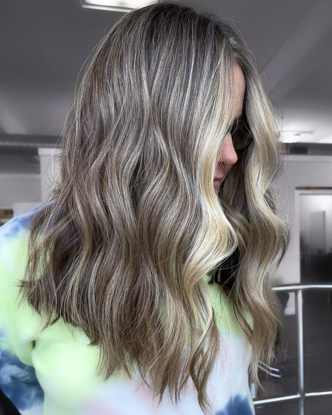 24. Subtle Ashy Blonde Waves Perfect for Grey Blending