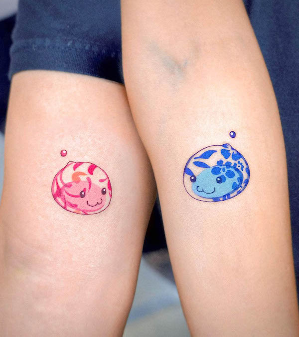 40. Whimsy in Color: Adorable Jellyfish Pair Tattoos