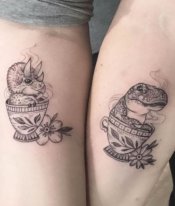 57. Whimsical Dinosaurs in Teacups: A Playful Couple's Tattoo Idea