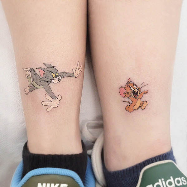 56. Playful Chaos Captured in Tom and Jerry Tattoos